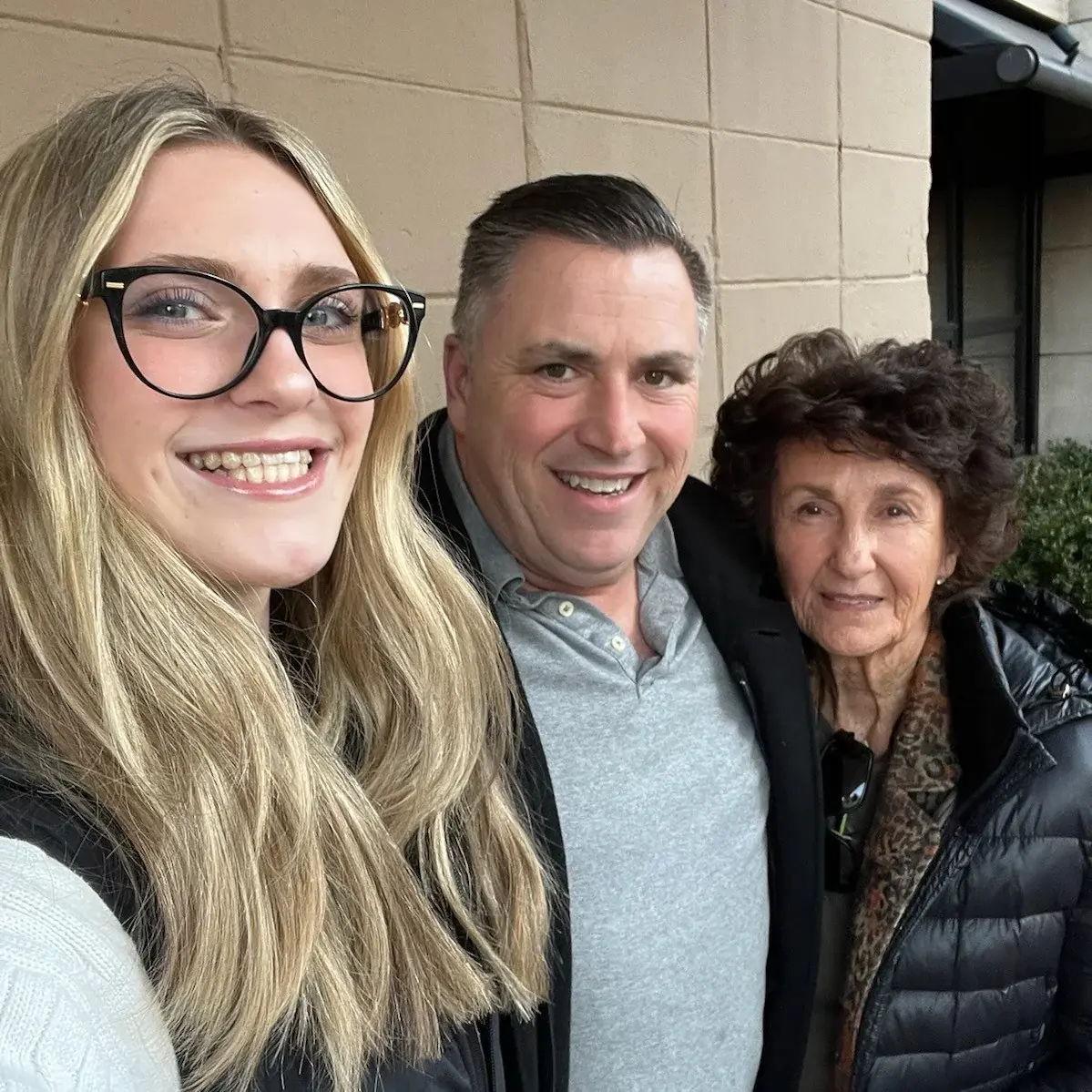 Joel with his daughter on the left and his mother on the right